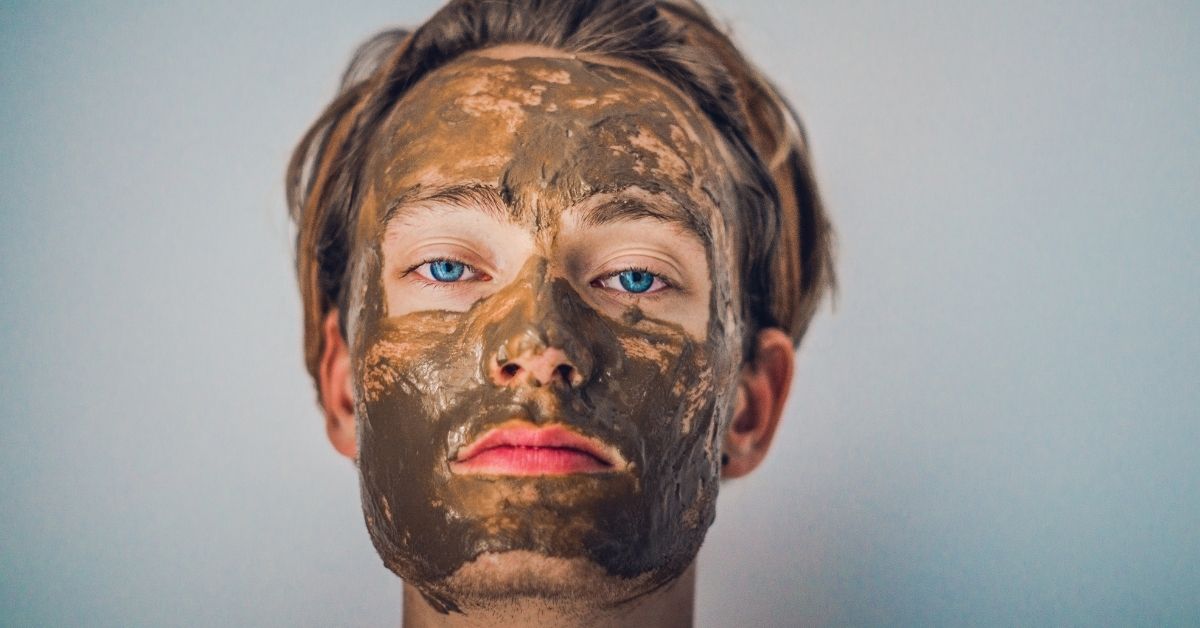 woman with clay mask